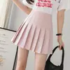 Falda corta simple de tiro alto para mujer, primavera/verano, falda plisada de uniforme JK de color liso, falda pantalón anti-exposición, minifalda de línea A