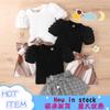 Traje de primavera y verano para niñas de Amazon, estilo europeo y americano, con mangas abullonadas y falda a cuadros con lazo, venta al por mayor