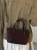 Bolsa de ombro estilosa e moderna para mulheres, apresentando um design único e chique, perfeita para uso casual, e uma nova coleção outono 2026 com um design de bolsa tipo balde texturizado de alta qualidade.