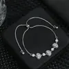 Pulseira de Zircônia Micro-Pavimentada Banhada a Ouro Real, Levemente Luxuosa, para Mulheres, Toque de Alto Padrão, Formato de Coração, Ajustável com Cordão de Puxar, Pulseira Exquisita
