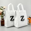 Bolsas de tela no tejidas al por mayor, personalizadas con película aislante térmica, bolsas publicitarias, bolsas de compra, bolsas de regalo, bolsas para ropa y zapatos.