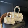 Bolso Platino de Gran Capacidad Bolso de Mujer Patrón Granulado Simple Elegante Bolso de Hombro Estilo Extranjero Versátil Cerradura Bolso Cruzado Portátil