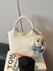 Bolsa Cesta de Legumes Portátil de Nicho Coreana para Mulheres 2026 Nova Moda Versátil Bolsa Balde Simples Super Popular Bolsa Transversal