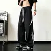 Calças de paraquedista listradas com retalhos de secagem rápida para homens, calças largas casuais de verão estilo americano high street, calças cargo casuais curvas da moda