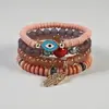 Venta Caliente Transfronteriza Estilo Bohemio Ojo Maligno Palma Aleación Colgante Cuerda Elástica Multicapa Pulsera de Perlas