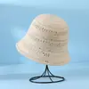 Nuevo sombrero estilo coreano 2025, elegante sombrero de pescador de ganchillo con diseño calado, hace que la cara parezca más pequeña, sombrero de punto para mujer, sombrero de cubo de verano, sombrero para el sol