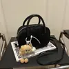 Bolsa Feminina 2025 Nova Textura Fosca Moda Ombro Mensageiro Bolsa Feminina Casual Portátil Boston Bolsa Bowling