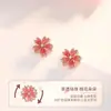 Brincos de flor de pessegueiro rotativos femininos ins simples nicho doces brincos luxo leve alta qualidade tátil brincos fabricantes atacado