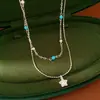 Colar de pedras com duas camadas, estrelas de zircônia e pérolas, corrente para clavícula de luxo leve e nicho, acessório elegante e versátil para o dia a dia