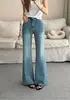 Pantalones de campana petite de nueve puntos elásticos en cuatro direcciones, cómodos y adelgazantes, jeans negros de microcampana de algodón de Xinjiang para mujer, versátiles 2026