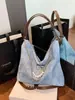Bolsa tote de gran capacidad para mujer, nueva moda 2026, bolso de hombro versátil, mochila de alta gama para estudiante universitario para salir