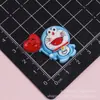 Accesorios de pegamento de crema de Doraemon de dibujos animados, adornos para hebillas de zapatos, materiales de resina para manualidades DIY, pegatinas para fundas de teléfono