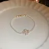 [Cadena de Diamantes Arcoíris] Pulsera de extracción de zircón trenzado en cruz, una pulsera lujosa y de alta gama, una pieza de joyería delicada y de moda