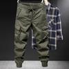 Primavera e Outono Nova Crock Calças Masculinas Moda Marca Perna Solta Montanhismo ao ar livre Tático Estilo Americano Multi-Pocket Calças Casuais