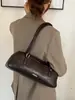 Nova bolsa de nicho estilo francês transfronteiriça para mulheres, bolsa baguette vintage de ombro, elegante para o trabalho e uso casual, bolsa de mão e bolsa de ombro versátil