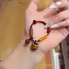 Pulsera de Hilo Rojo con Huesos de Durazno para la Buena Suerte en el Año Zodiacal de Uno, Adecuada para Hombres, Mujeres, Bebés y Niños, Tejida para Protección Contra el Miedo, Hecha de Madera de Durazno Vieja