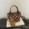 2026 Otoño Temprano Nuevo Exquisito Bolso Cruzado de Lunares para Mujer Bolso de Cubo Vintage de Gamuza de Moda Bolsos para Mujer al por Mayor