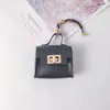 Nova Mini Bolsa Carteira com Pingente em Formato de Casa, Pequena Bolsa de Luxo, Novo Acessório de Moda, Bolsa para Batom, Bolsinha para Fones de Ouvido e Chaves