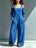 Macacão de um ombro com blocos de cor para mulheres, modelo 2026, disponível em estoque, para uso transfronteiriço, corte solto com bolsos grandes, pernas largas, comprimento até o chão, macacão de alça