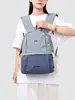 Mochila de estudiante para el día a día con bloqueo de color estilo dopamina transfronteriza, mochila ligera de gran capacidad para viajes al aire libre para mujer
