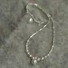 Collar de perlas de metal plateado fragmentado de alta gama para mujer, personalidad retro francesa, cadena para la clavícula tipo gargantilla versátil de lujo ligero