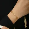 Estilo Europeu e Americano Trevo de Quatro Folhas Cravejado com Diamantes Aço Inoxidável Banhado a Ouro 18K Pulseira de Luxo de Nicho High-End para Mulheres Versátil Atacado