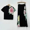 Conjunto femenino estilo Miyake con estampado elegante, estilo suave, camiseta de manga corta y falda de cintura alta, conjunto versátil de dos piezas