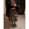 Producto auténtico oker. Diseño coreano con un estampado de leopardo irregular, dulce y fresco y dobladillo con volantes, falda de longitud media A1060