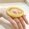 Imitação de fábrica pulseira de jade pulseira de vidro pagamento de dívidas Jade barra redonda leite amarelo jade pulseira tenda Jade 10 yuan modelo