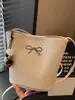 2026 Verano Nuevo Modelo Patrón Tejido Diseño de Nicho Bolso de Mano para Mujer Bolso Cubo de Color Sólido de Alto Valor Bolso de Hombro Único