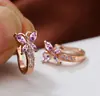 Pendientes pastorales retro de primavera y verano de comercio exterior transfronterizo con hebilla de mariposa pequeña de circonita para mujer.