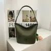 Bolsa de axila tecida de nicho transfronteiriça para mulheres, nova bolsa de mão da moda 2026, bolsa de ombro e transversal versátil de palha