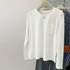 Camiseta de manga larga de diseño de bolsillo estilo americano, toma real, nicho para mujer, versión coreana de principios de otoño, top base suelto y adelgazante