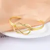Pulseira de aço inoxidável hidráulica em forma de C com nó de camada dupla banhada a vácuo 18K com gota de óleo, pulseira de exportação transfronteiriça atacado africano
