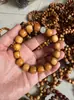 Pulseira Taihang Yabai Envelhecida Pulseira de Óleo Preto Natural Pulseira de Alta Densidade Bola de Buda de Madeira Padrão Gentiana Onda d'Água Atacado