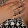 Anillo de acero inoxidable Wanxing de estilo europeo y americano, con personalidad a juego, dorado y plateado, con apertura hueca y amor, anillo de acero de titanio, joyería transfronteriza.