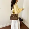 Elegante bolsa de mão preta platina para mulheres, novo modelo outono e inverno 2026, bolsa de mão de grande capacidade com padrão texturizado, bolsa tote para o dia a dia