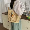 Bolso tote tejido hueco versátil simple y elegante de nicho nuevo 2026 transfronterizo, bolso de mano, bolso de hombro, bolso de axila