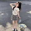 Conjunto de Falda de Traje Delgado de Verano 2026 Estilo Universitario Dibujos Animados Top de Manga Corta Casual Dulce Cuadros Falda de Pastel Conjunto de Dos Piezas