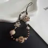 Capa de Celular com Lanyard Corrente de Bolinha de Pelo Estampa de Leopardo Estrela High-End Ins Corrente Curta Ccd Chaveiro Novo Estilo Tendência para Homens e Mulheres