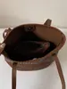 Bolsa de Mano Tejida Shuai Mijia para Mujer 2026 Nuevo Bolso Cubo de Verano Alta Apariencia Temperamento de Nicho Bolso de Hombro Simple