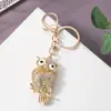 Nuevo y lindo búho de peluche, accesorio colgante de llavero de metal, pequeño regalo creativo para estudiantes y parejas