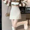 Falda de cuero para mujer, colección otoño 2026, de cintura alta, moderna, versátil, a la moda, con una abertura de un solo paso, línea A sexy y una silueta ajustada