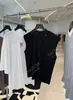26 Nuevo Estilo de Principios de Primavera Camisa Chaleco de Algodón Orgánico Hilado Siro Etiqueta Metálica Hombro Ancho Adelgazante Cuello Redondo Manga Corta