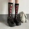 Calcetines de pantorrilla con agujeros y lazo para niñas JK Calcetines de longitud media Medias de lolita con agujeros y lazo