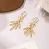 Aretes Colgantes Largos con Borla de Flor Pequeña de Piedra Ojo de Gato para Mujer Diseño con Sentido Popular en Internet Aretes Versátiles Nuevos Aretes de Moda