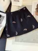 Falda corta de lana con lentejuelas de moda estilo coreano para mujer, nueva falda corta de línea A anti-exposición de otoño para mujeres petite