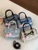 Bolsa Boston fofa estilo coreano com laço, bolsa de mão de bolinhas de nicho, moderna e na moda, bolsa de ombro fresca e doce