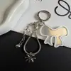 Cadena de teléfono de hueso de serpiente de espejo acrílico simple y fresca, llavero versátil creativo colgante de bolso cadena de hueso de serpiente
