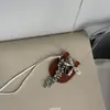 Bolso Pequeño de Cuero de Diseñador Único con Lazo de Perlas Cadena Larga para Suéter Dulce Fresco Personalidad Accesorio de Bolso Ins para Mujeres